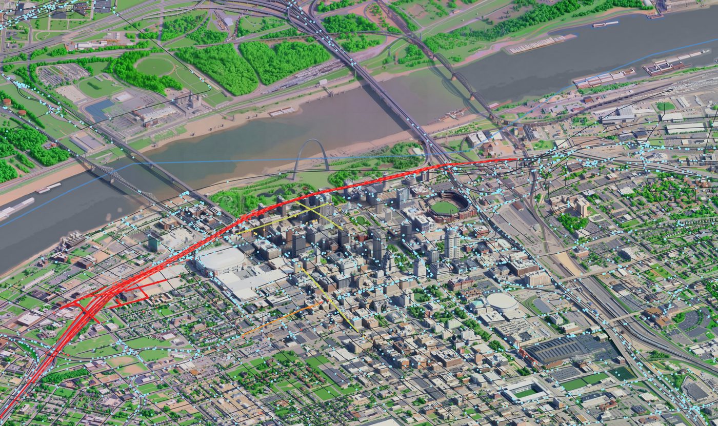 The isometric St. Louis diorama with a live Waze jam glowing red across the highway